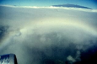 Rainbow in clouds, as seen from airplane, Hawaii.